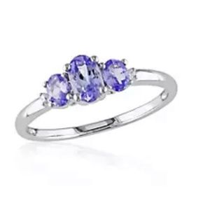White gold ring with 3 purple stones